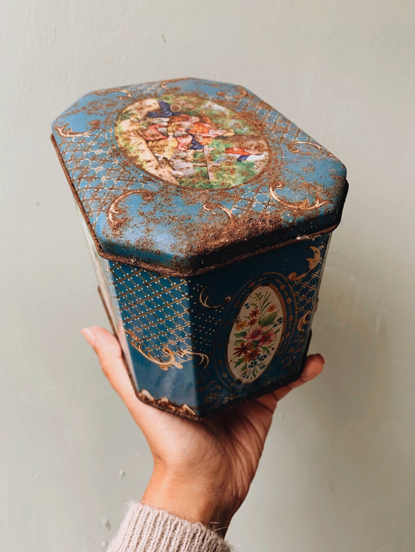 Vintage Biscuit Tin Adorned with Narrative & Decoration