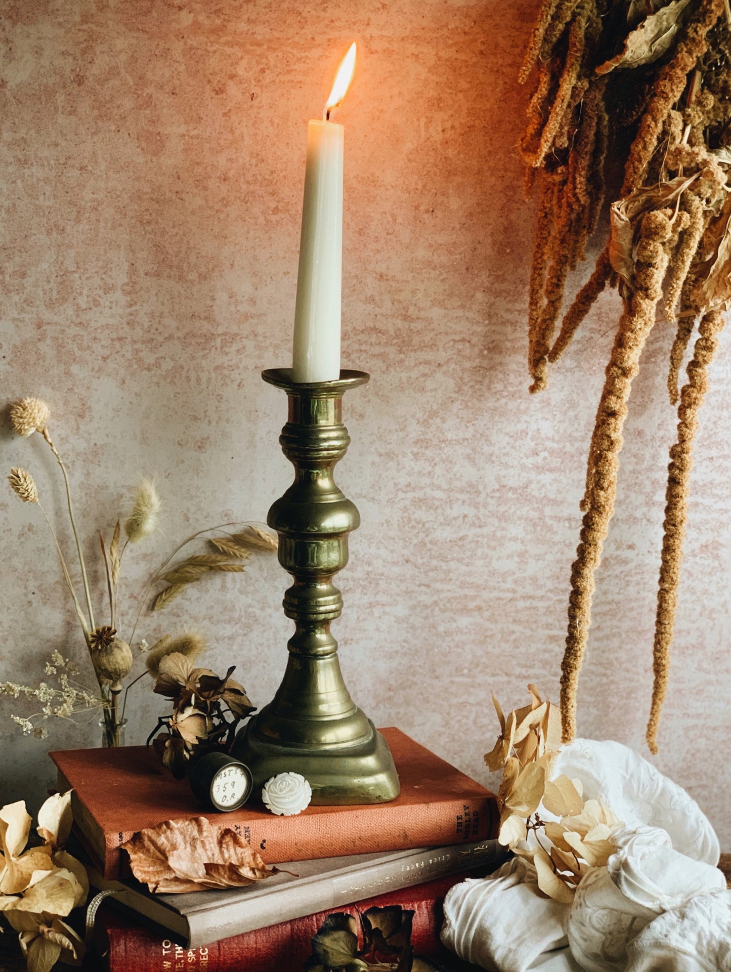 A Pair of Antique Brass Candle Sticks