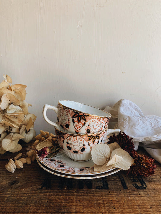 Antique Floral Gilt and Orange Cup and Saucer (sold separately)