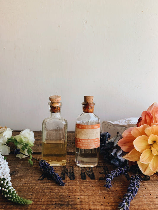 Two Antique Apothecary Bottles