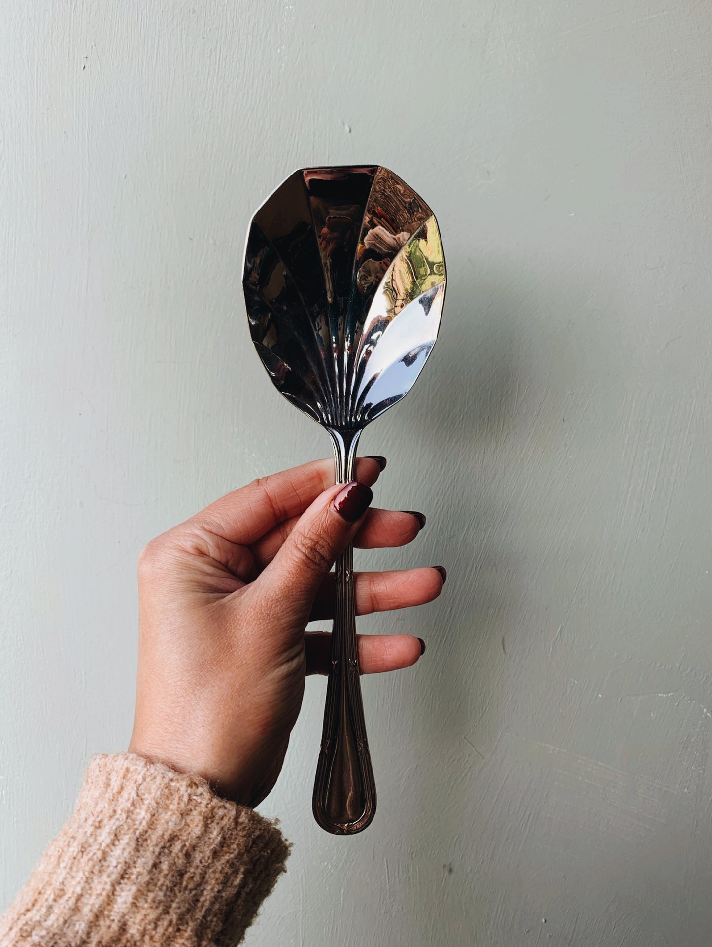 A Set of Seven Scalloped Vintage Spoons (with original box)