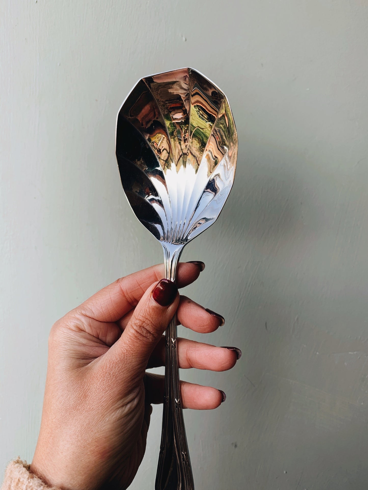 A Set of Seven Scalloped Vintage Spoons (with original box)