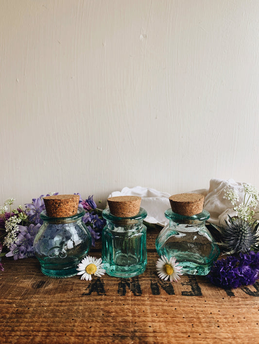 Three Vintage Bottles with Cork Tops