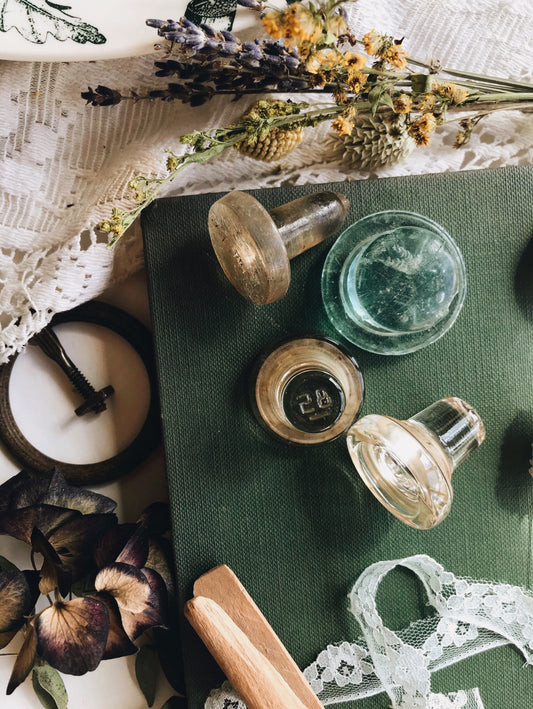 Four Antique Apothecary Bottle Tops