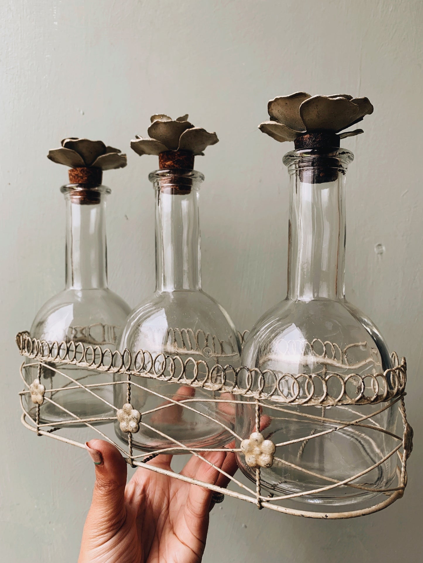 Vintage Set of French Bottles with Floral Ceramic Cork Stoppers in Basket