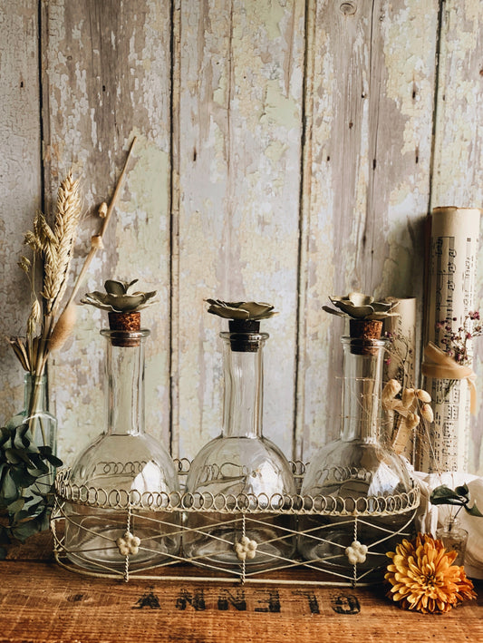 Vintage Set of French Bottles with Floral Ceramic Cork Stoppers in Basket