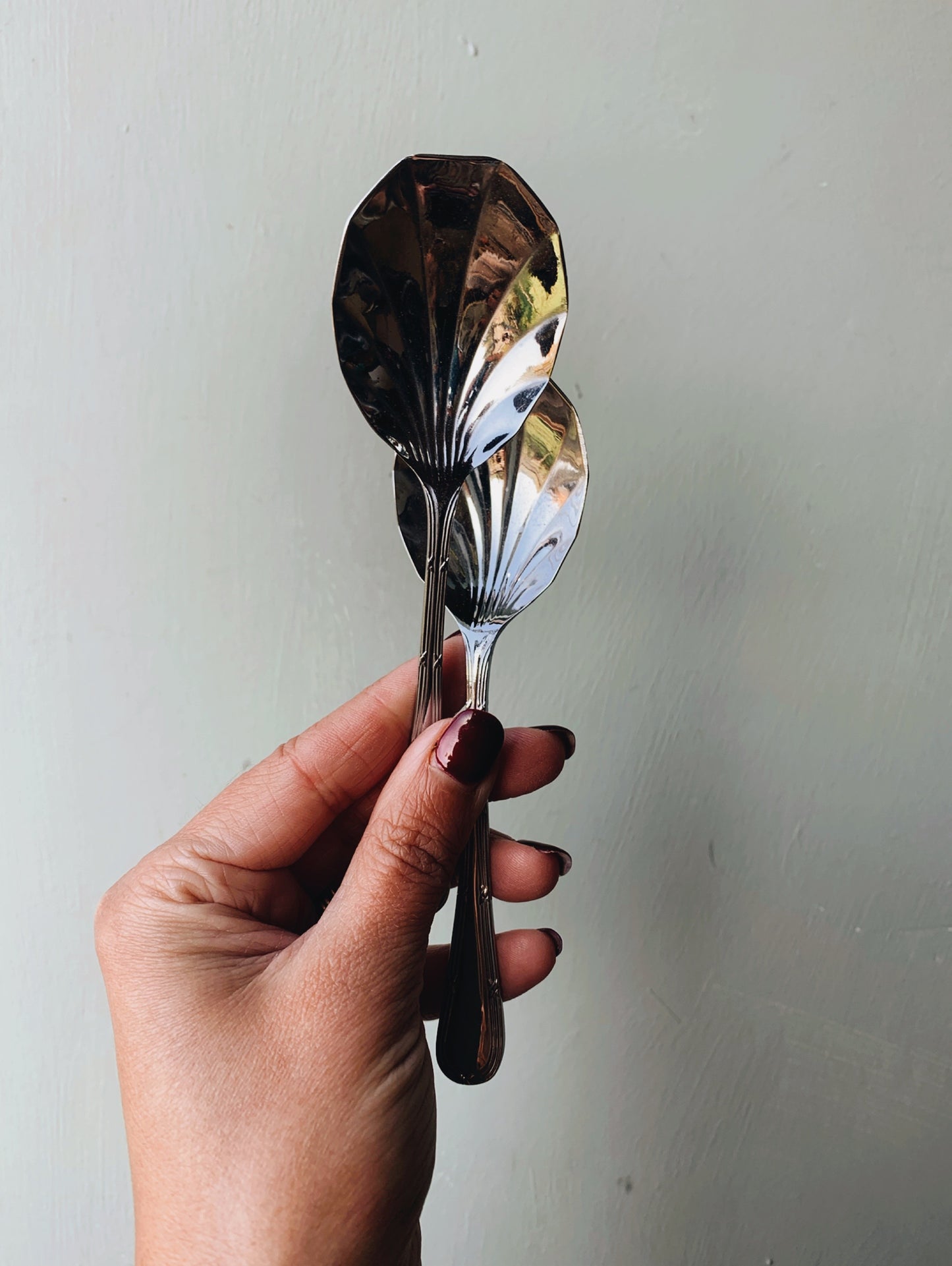 A Set of Seven Scalloped Vintage Spoons (with original box)